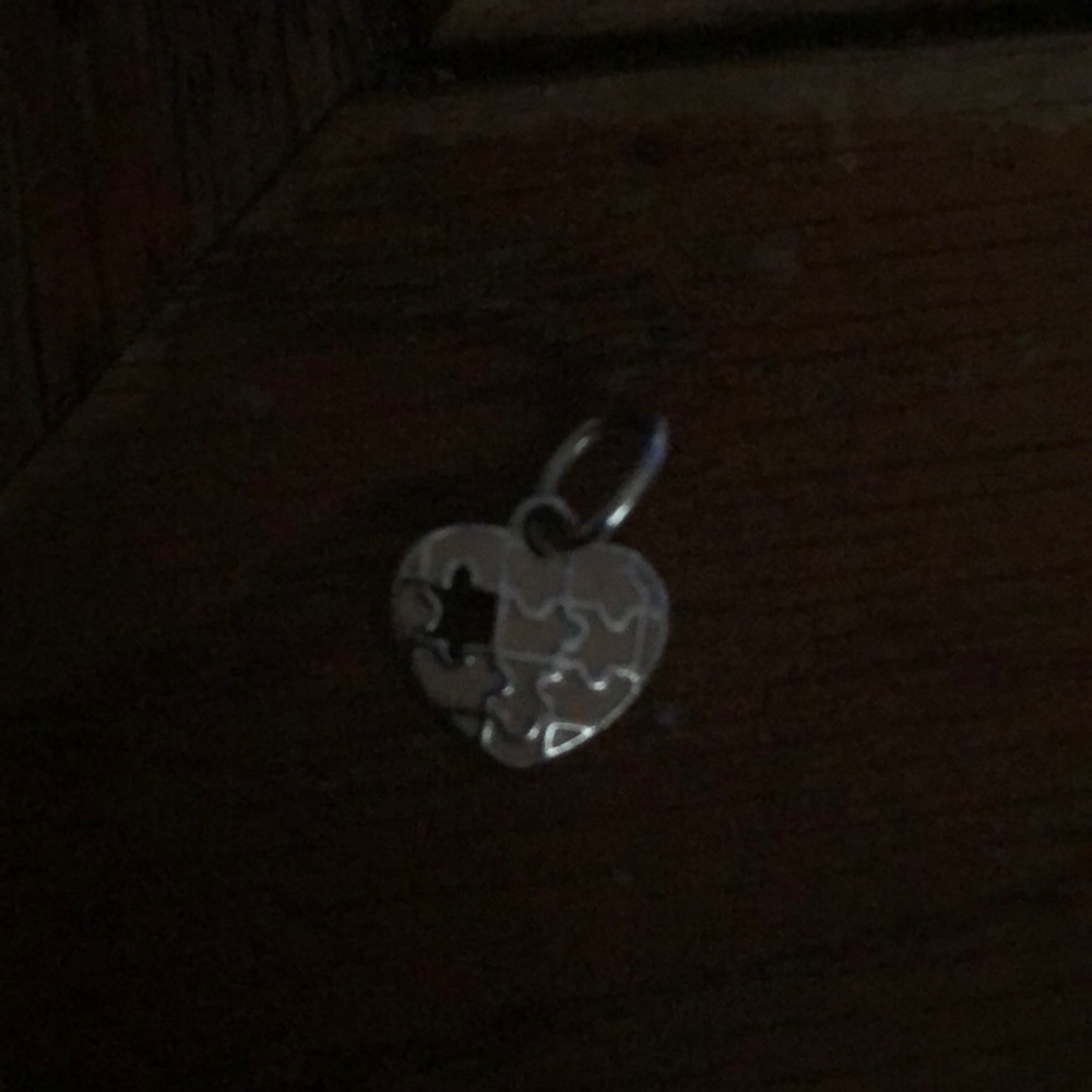 Sterling silver charm with pink enamel